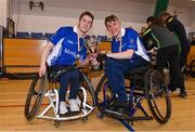 21 October 2023; Munster captain Cian Horgan, left, and vice-captain Darren Dineen with the cup after the 2023 Wheelchair Hurling / Camogie All Ireland Final match between Ulster and Munster at SETU Carlow Sports Hall in Carlow. Photo by Ben McShane/Sportsfile