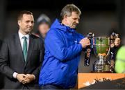 20 October 2023; Noel Mernagh, captain of the 1993 Galway United First Division winning team, brings the SSE Airtricity Men's First Division cup to the presentation area after the SSE Airtricity Men's First Division match between Galway United and Wexford at Eamonn Deacy Park in Galway. Photo by Stephen McCarthy/Sportsfile