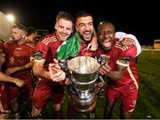 20 October 2023; Galway United players, from left, Rob Slevin, Wassim Aouachria and Francely Lomboto celebrate with the SSE Airtricity Men's First Division cup after the SSE Airtricity Men's First Division match between Galway United and Wexford at Eamonn Deacy Park in Galway. Photo by Stephen McCarthy/Sportsfile