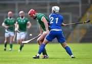 21 October 2023; Fionan Mackessy of Ireland in action against Iain Robinson of Scotland during the 2023 Hurling Shinty International Game between Ireland and Scotland at Páirc Esler in Newry, Down. Photo by Piaras Ó Mídheach/Sportsfile