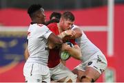 21 October 2023; Jack O’Donoghue of Munster is tackled by Phepsi Buthelezi, left, and Emile van Heerden of Hollywoodbets Sharks during the United Rugby Championship match between Munster and Hollywoodbets Sharks at Thomond Park in Limerick. Photo by Seb Daly/Sportsfile