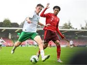 17 October 2023; Luke O'Donnell of Republic of Ireland in action against Enrique Aguilar of Switzerland during the UEFA European U17 Championship qualifying group 10 match between Switzerland and Republic of Ireland at Turner's Cross in Cork. Photo by Eóin Noonan/Sportsfile