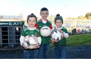 22 October 2023; The O'Rourke brothers, from left, Killian, age 4, Oisín, age 6, and Patrick, age 4, from Inniskeen, Co Monaghan, before the Monaghan County Senior Club Football Championship final between Inniskeen and Scotstown at St Tiernach's Park in Clones, Monaghan. Photo by Philip Fitzpatrick/Sportsfile