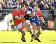 22 October 2023; Dan Cooney of Blessington in action against Gary Byrne, Sam O'Dowd and Fionn O'Sullivan of Rathnew during the Wicklow County Senior Club Football Championship final between Blessington and Rathnew at Echelon Park in Aughrim, Wicklow. Photo by Matt Browne/Sportsfile