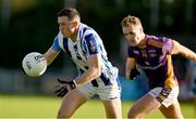 22 October 2023; Ryan Basquel of Ballyboden St Endas in action against Shane Cunningham of Kilmacud Crokes during the Dublin County Senior Club Football Championship Final between Kilmacud Crokes and Ballyboden St Endas at Parnell Park in Dublin. Photo by Brendan Moran/Sportsfile