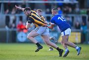 22 October 2023; Daniel Cumisky of Crossmaglen Rangers is tackled by Ciaran Campbell of Clan na Gael during the Armagh County Senior Club Football Championship final between Clan na Gael and Crossmaglen Rangers at BOX-IT Athletic Grounds in Armagh. Photo by Ben McShane/Sportsfile