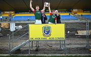 22 October 2023; St Brigids co-captains Mark Daly, left, and Paul McGrath lift the cup after their side's victory in the Roscommon County Senior Club Football Championship final match between St Brigids and Boyle at Dr Hyde Park in Roscommon. Photo by Harry Murphy/Sportsfile