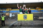 22 October 2023; St Brigids co-captains Mark Daly, left, and Paul McGrath lift the cup after their side's victory in the Roscommon County Senior Club Football Championship final match between St Brigids and Boyle at Dr Hyde Park in Roscommon. Photo by Harry Murphy/Sportsfile