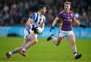 22 October 2023; James Holland of Ballyboden St Endas in action against Mark O'Leary of Kilmacud Crokes during the Dublin County Senior Club Football Championship Final between Kilmacud Crokes and Ballyboden St Endas at Parnell Park in Dublin. Photo by Brendan Moran/Sportsfile