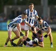 22 October 2023; Rory O'Carroll of Kilmacud Crokes is tackled by Ryan Basquel, left, and Colm Basquel of Ballyboden St Endas during the Dublin County Senior Club Football Championship Final between Kilmacud Crokes and Ballyboden St Endas at Parnell Park in Dublin. Photo by Brendan Moran/Sportsfile