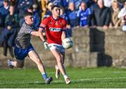 22 October 2023; Jay Crawley of Ardee St Mary's in action against Tadhg O'Brien of Naomh Mairtin during the Louth County Senior Club Football Championship final between Ardee St Mary's and Naomh Mairtin at Pairc Naomh Bríd in Dowdallshill, Louth. Photo by Stephen Marken/Sportsfile