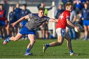 22 October 2023; Dáire McConnon of Ardee St Mary's in action against Thomas O'Sullivan of Naomh Mairtin during the Louth County Senior Club Football Championship final between Ardee St Mary's and Naomh Mairtin at Pairc Naomh Bríd in Dowdallshill, Louth. Photo by Stephen Marken/Sportsfile