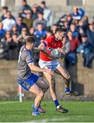 22 October 2023; Dáire McConnon of Ardee St Mary's in action against Thomas O'Sullivan of Naomh Mairtin during the Louth County Senior Club Football Championship final between Ardee St Mary's and Naomh Mairtin at Pairc Naomh Bríd in Dowdallshill, Louth. Photo by Stephen Marken/Sportsfile