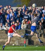 22 October 2023; Dáire McConnon of Ardee St Mary's scores a point despite pressure from Shane Morgan of Naomh Mairtin during the Louth County Senior Club Football Championship final between Ardee St Mary's and Naomh Mairtin at Pairc Naomh Bríd in Dowdallshill, Louth. Photo by Stephen Marken/Sportsfile