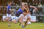 22 October 2023; Thomas Og Duffy of Crossmaglen Rangers is tackled by Jamie Brady of Clan na Gael, resulting in a penalty, during the Armagh County Senior Club Football Championship final between Clan na Gael and Crossmaglen Rangers at BOX-IT Athletic Grounds in Armagh. Photo by Ben McShane/Sportsfile