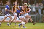 22 October 2023; Thomas Og Duffy of Crossmaglen Rangers is tackled by Jamie Brady of Clan na Gael, resulting in a penalty, during the Armagh County Senior Club Football Championship final between Clan na Gael and Crossmaglen Rangers at BOX-IT Athletic Grounds in Armagh. Photo by Ben McShane/Sportsfile