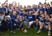 22 October 2023; Ardee St. Mary's players and supporters with the Joe Ward Cup after the Louth County Senior Club Football Championship final between Ardee St Mary's and Naomh Mairtin at Pairc Naomh Bríd in Dowdallshill, Louth. Photo by Stephen Marken/Sportsfile