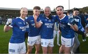 22 October 2023; Naomh Conaill players, from left, Anthony Thompson, Odhran Doherty, Eoin Waide and Ciaran Thompson celebrate after the Donegal County Senior Club Football Championship final between Gaoth Dobhair and Naomh Conaill at MacCumhaill Park in Ballybofey, Donegal. Photo by Ramsey Cardy/Sportsfile