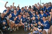22 October 2023; The Naomh Conaill team celebrate with the cup after the Donegal County Senior Club Football Championship final between Gaoth Dobhair and Naomh Conaill at MacCumhaill Park in Ballybofey, Donegal. Photo by Ramsey Cardy/Sportsfile