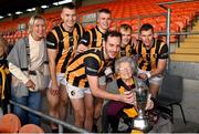 22 October 2023; Crossmaglen Rangers lifelong supporter Margaret McConville, right, with the cup and Crossmaglen Rangers players, from left, Rian O'Neill, Jamie Clarke, Dara O'Callaghan, captain Jamie Clarke, Cian McConville and Oisin O'Neill, with Dora O'Neill, left, mother of Rian, Oisin and Aaron O'Neill, after the Armagh County Senior Club Football Championship final between Clan na Gael and Crossmaglen Rangers at BOX-IT Athletic Grounds in Armagh. Photo by Ben McShane/Sportsfile