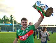 22 October 2023; Oisin Pierson of Gowna celebrates with the trophy after his side's victory in the Cavan County Senior Club Football Championship final between Kingscourt Stars and Gowna at Kingspan Breffni in Cavan. Photo by Tyler Miller/Sportsfile