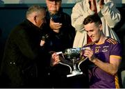 22 October 2023; Kilmacud Crokes captain Shane Cunningham is presented with the Clery's cup by outgoing Dublin County Board chief excutive John Costello after the Dublin County Senior Club Football Championship Final between Kilmacud Crokes and Ballyboden St Endas at Parnell Park in Dublin. Photo by Brendan Moran/Sportsfile