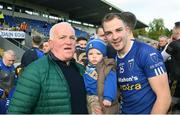 22 October 2023; Seanie McQuillian of Scotstown with Jack McCarron, age 1, and Ray McCarron after the Monaghan County Senior Club Football Championship final between Inniskeen and Scotstown at St Tiernach's Park in Clones, Monaghan. Photo by Philip Fitzpatrick/Sportsfile