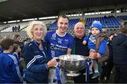 22 October 2023; Seanie McQuillian of Scotstown with Jack McCarron, age 1, Ray and Patricia McCarron after the Monaghan County Senior Club Football Championship final between Inniskeen and Scotstown at St Tiernach's Park in Clones, Monaghan. Photo by Philip Fitzpatrick/Sportsfile