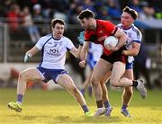 22 October 2023; Kevin Flynn of Celbridge in action against Cathal Daly, left, and Jack McKevitt of Naas during the Kildare County Senior Club Football Championship final between Celbridge and Naas at Netwatch Cullen Park in Carlow. Photo by Piaras Ó Mídheach/Sportsfile