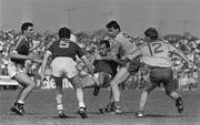 22 July 1990; Brian Moylan, Galway, supported by left, Alan Mullolhand and John Fallon, 5, is tackled by John Newton, 9, and Andy Leyland, 12, Roscommon. Galway v Roscommon, Connacht Football Championship Finals, Dr Hide Park, Co. Roscommon. Picture credit; Ray McManus / SPORTSFILE