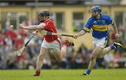10 July 2004; Wayne Sherlock, Cork, in action against Eoin Kelly, Tipperary. Guinness Senior Hurling Championship Qualifier, Round 3, Cork v Tipperary, Fitzgerald Stadium, Killarney, Co. Kerry. Picture credit; Brendan Moran / SPORTSFILE