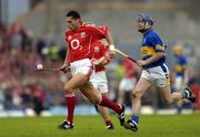 10 July 2004; Sean og O'hAilpin, Cork, in action against Paul Kelly, Tipperary. Guinness Senior Hurling Championship Qualifier, Round 3, Cork v Tipperary, Fitzgerald Stadium, Killarney, Co. Kerry. Picture credit; Brendan Moran / SPORTSFILE