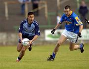 10 July 2004; Jason Sherlock, Dublin, in action against Martin Mulleady, Longford. Bank of Ireland Senior Football Championship Qualifier, Round 3, Dublin v Longford, O'Moore Park, Portlaoise, Co. Laois. Picture credit; Ray McManus / SPORTSFILE