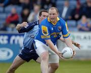 10 July 2004; Niall Sheridan, Longford, is tackled by Dublin's Paddy Christie. Bank of Ireland Senior Football Championship Qualifier, Round 3, Dublin v Longford, O'Moore Park, Portlaoise, Co. Laois. Picture credit; Ray McManus / SPORTSFILE