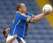 10 July 2004; Niall Sheridan, Longford, is tackled by Paddy Christie, Dublin. Bank of Ireland Senior Football Championship Qualifier, Round 3, Dublin v Longford, O'Moore Park, Portlaoise, Co. Laois. Picture credit; Pat Murphy / SPORTSFILE