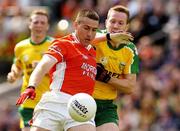 11 July 2004; Diarmuid Marsden, Armagh, is tackled by Raymond Sweeney, Donegal. Bank of Ireland Ulster Senior Football Championship Final, Armagh v Donegal, Croke Park, Dublin. Picture credit; Matt Browne / SPORTSFILE