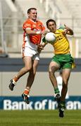 11 July 2004; Aidan O'Rourke, Armagh, contests a high ball with Michael Hegarty, Donegal. Bank of Ireland Ulster Senior Football Championship Final, Armagh v Donegal, Croke Park, Dublin. Picture credit; Damien Eagers / SPORTSFILE