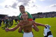 11 July 2004; Danny Murphy, top, Cork City, celebrates with team-mate John O'Flynn at the end of the game after victory over NEC Nijmegen. Intertoto Cup, Second round, Second leg, Cork City v NEC Nijmegen, Turners Cross, Cork. Picture credit; David Maher / SPORTSFILE