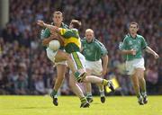 11 July 2004; Jason Stokes, Limerick, in action against William Kirby, Kerry. Bank of Ireland Munster Senior Football Championship Final, Limerick v Kerry, Gaelic Grounds, Limerick. Picture credit; Brendan Moran / SPORTSFILE