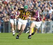 11 July 2004; Jimmy Coogan, Kilkenny, in action against Damien Joyce, Galway. Guinness Senior Hurling Championship Qualifier, Round 3, Galway v Kilkenny, Semple Stadium, Thurles, Co. Tipperary. Picture credit; Ray McManus / SPORTSFILE