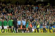 6 September 2013; Model Nadia Forde leaves the field after singing the National Anthem before the game. 2014 FIFA World Cup Qualifier, Group C, Republic of Ireland v Sweden, Aviva Stadium, Lansdowne Road, Dublin. Picture credit: Brian Lawless / SPORTSFILE