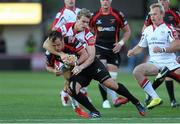 6 September 2013; Dan Evans, Newport Gwent Dragons, is tackled by Andrew Trimble, Ulster. Celtic League 2013/14, Round 1, Newport Gwent Dragons v Ulster, Rodney Parade, Wales. Picture credit: Steve Pope / SPORTSFILE