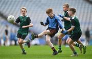 23 October 2023; Conor Kenny of St Attrachta's kicks a point despite the St Joseph's Terenure defence during the match between St Joseph's Terenure and St Attrachta's at the Allianz Cumann na mBunscol Finals at Croke Park in Dublin. Photo by Ben McShane/Sportsfile