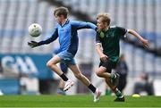 23 October 2023; Eoin O'Doyle of St Attrachta's in action against Alasdhair Gillespie of St Joseph's Terenure during the match between St Joseph's Terenure and St Attrachta's at the Allianz Cumann na mBunscol Finals at Croke Park in Dublin. Photo by Ben McShane/Sportsfile