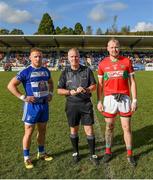 22 October 2023; Referee Keron Kenny with Kevin Hanlon captain of Blessington and Theo Smyth captain of Rathnew before the Wicklow County Senior Club Football Championship final between Blessington and Rathnew at Echelon Park in Aughrim, Wicklow. Photo by Matt Browne/Sportsfile