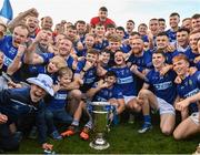 22 October 2023; Ardee St Mary's players and supporters with the Joe Ward Cup after the Louth County Senior Club Football Championship final between Ardee St Mary's and Naomh Mairtin at Pairc Naomh Bríd in Dowdallshill, Louth. Photo by Stephen Marken/Sportsfile