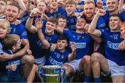 22 October 2023; Ardee St Mary's players and supporters with the Joe Ward Cup after the Louth County Senior Club Football Championship final between Ardee St Mary's and Naomh Mairtin at Pairc Naomh Bríd in Dowdallshill, Louth. Photo by Stephen Marken/Sportsfile