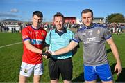 22 October 2023; Referee Colm McCullough with Kian Moran of Ardee St Mary's and Sam Mulroy of Naomh Mairtin before the Louth County Senior Club Football Championship final between Ardee St Mary's and Naomh Mairtin at Pairc Naomh Bríd in Dowdallshill, Louth. Photo by Stephen Marken/Sportsfile