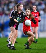 24 October 2023; Gaby Prendeville of Rolestown NS in action against Amber Tapley of Bayside SNS during the match between Rolestown NS and Bayside SNS at the Allianz Cumann na mBunscol Finals at Croke Park in Dublin. Photo by Ben McShane/Sportsfile