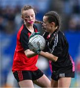 24 October 2023; Tara Cowap of Rolestown NS in action against Caoilinn Bourke of Bayside SNS during the match between Rolestown NS and Bayside SNS at the Allianz Cumann na mBunscol Finals at Croke Park in Dublin. Photo by Ben McShane/Sportsfile